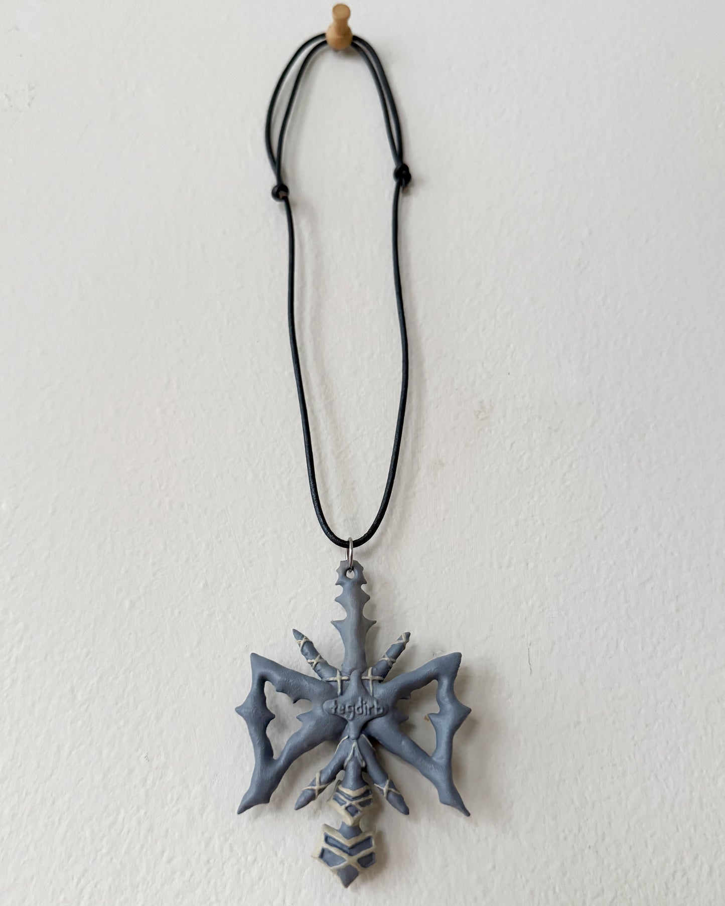 spikey bow drop necklace