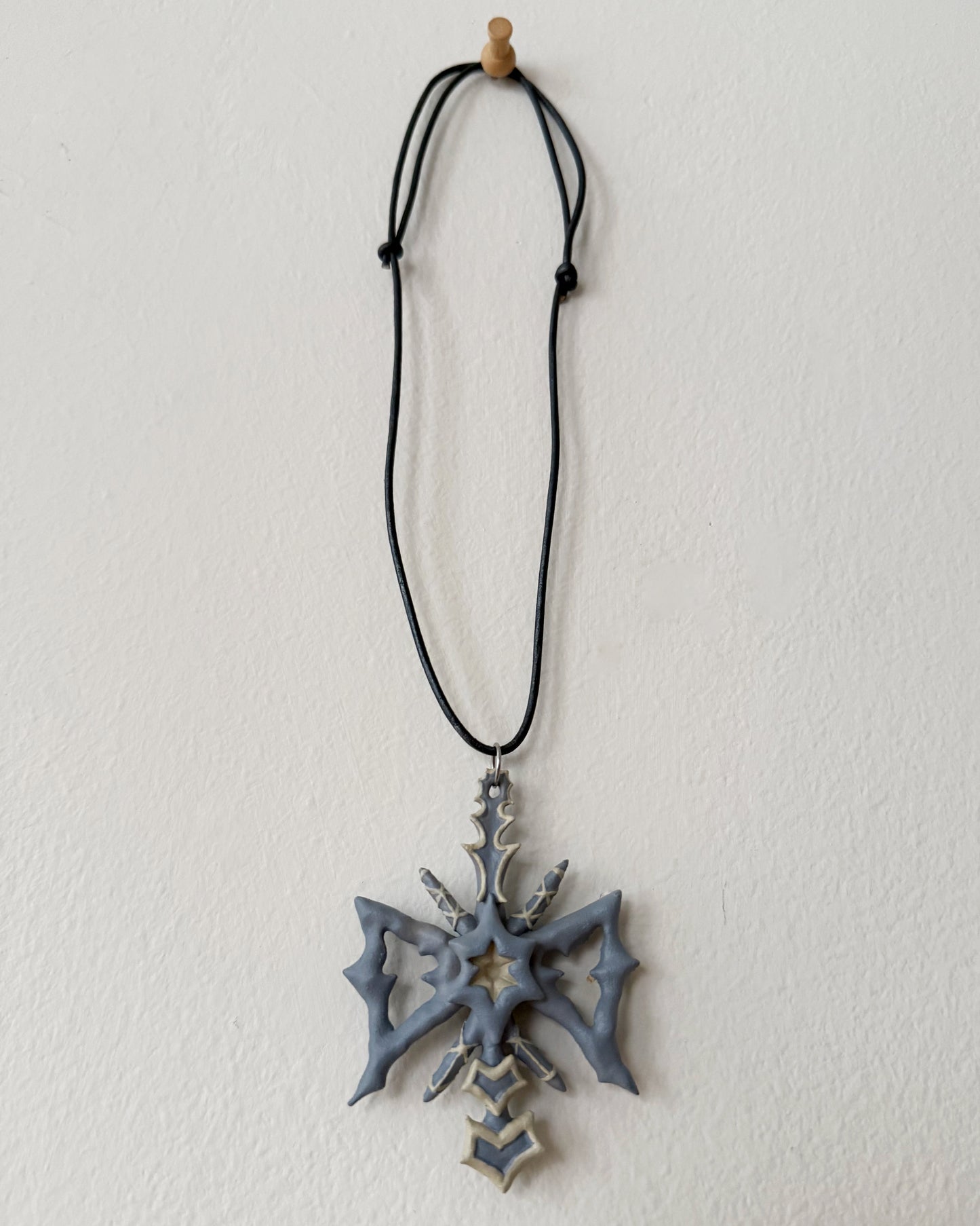 spikey bow drop necklace