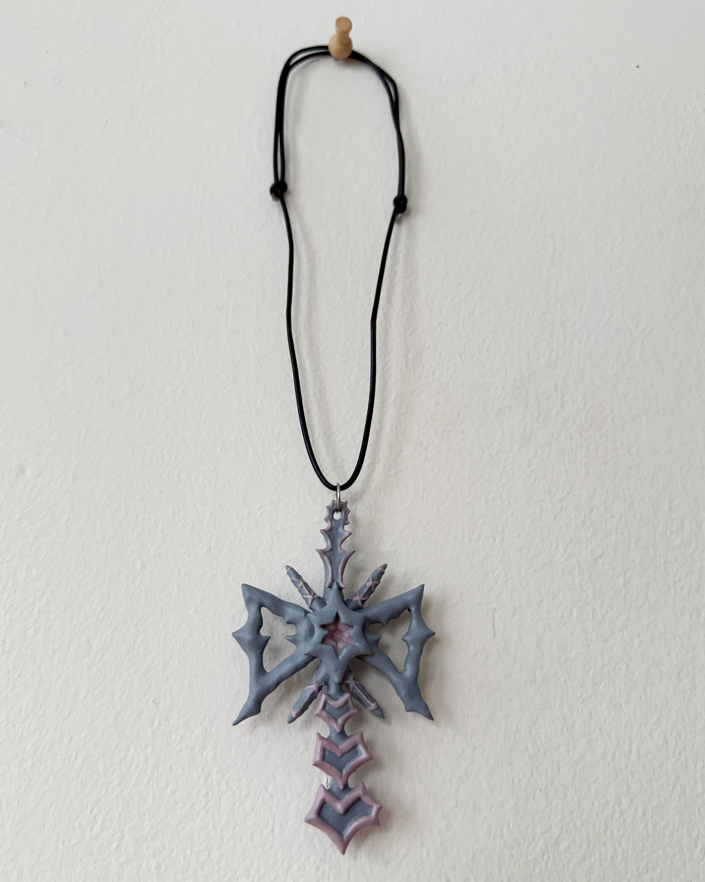 spikey bow drop necklace