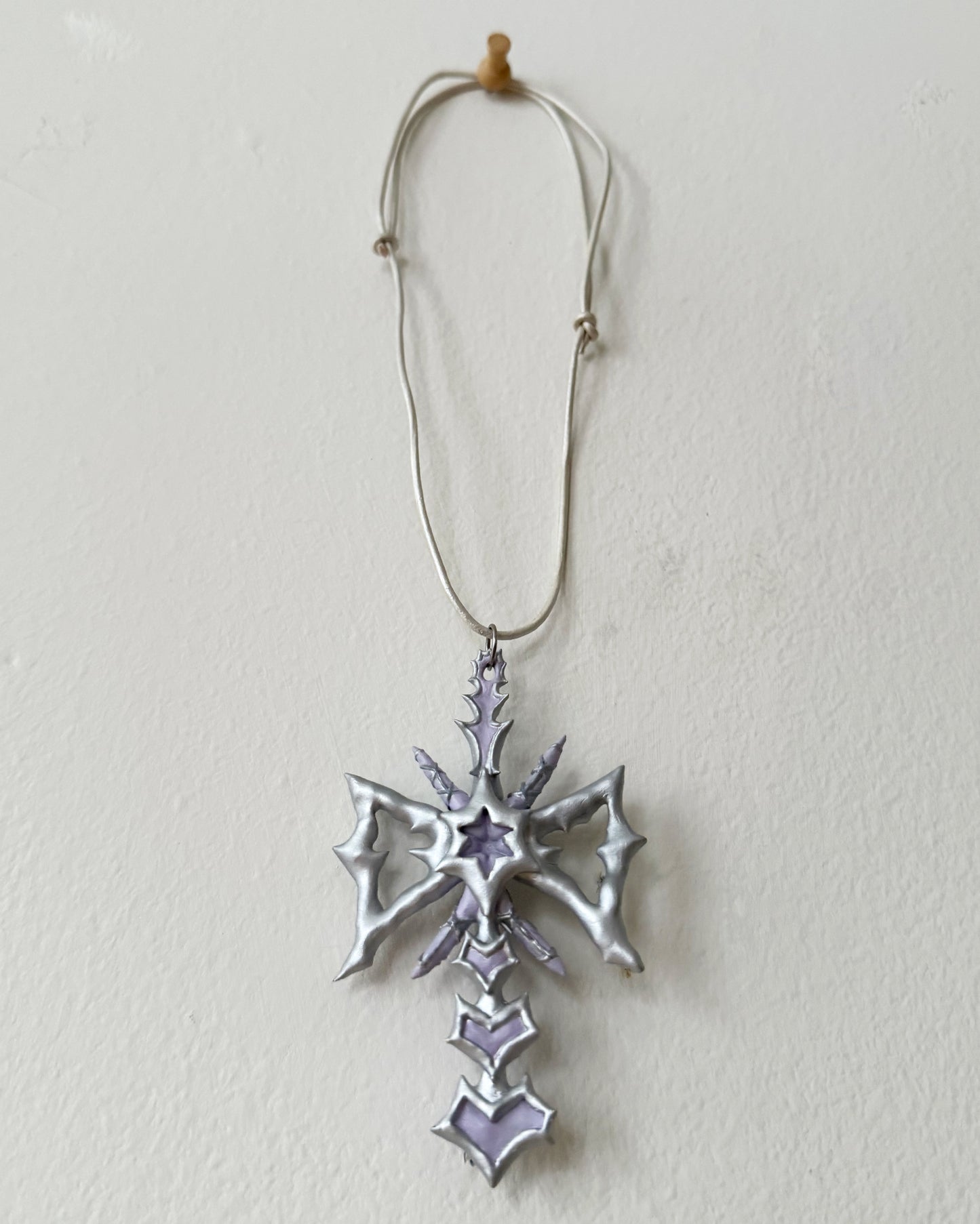 spikey bow drop necklace