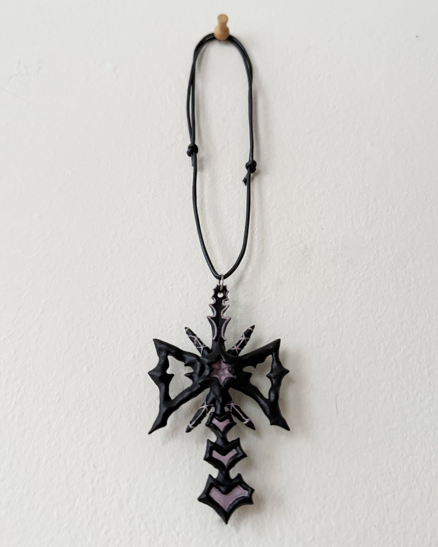 spikey bow drop necklace