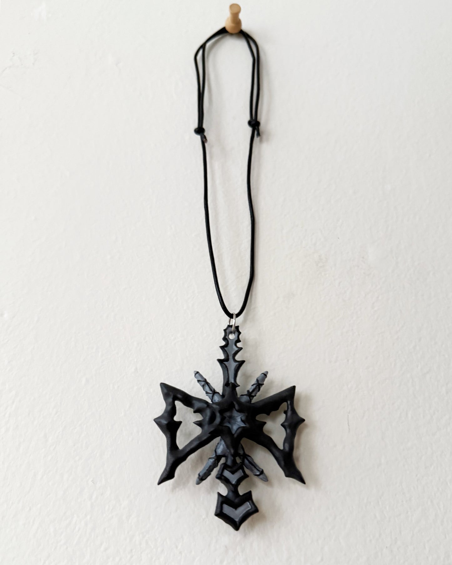 spikey bow drop necklace