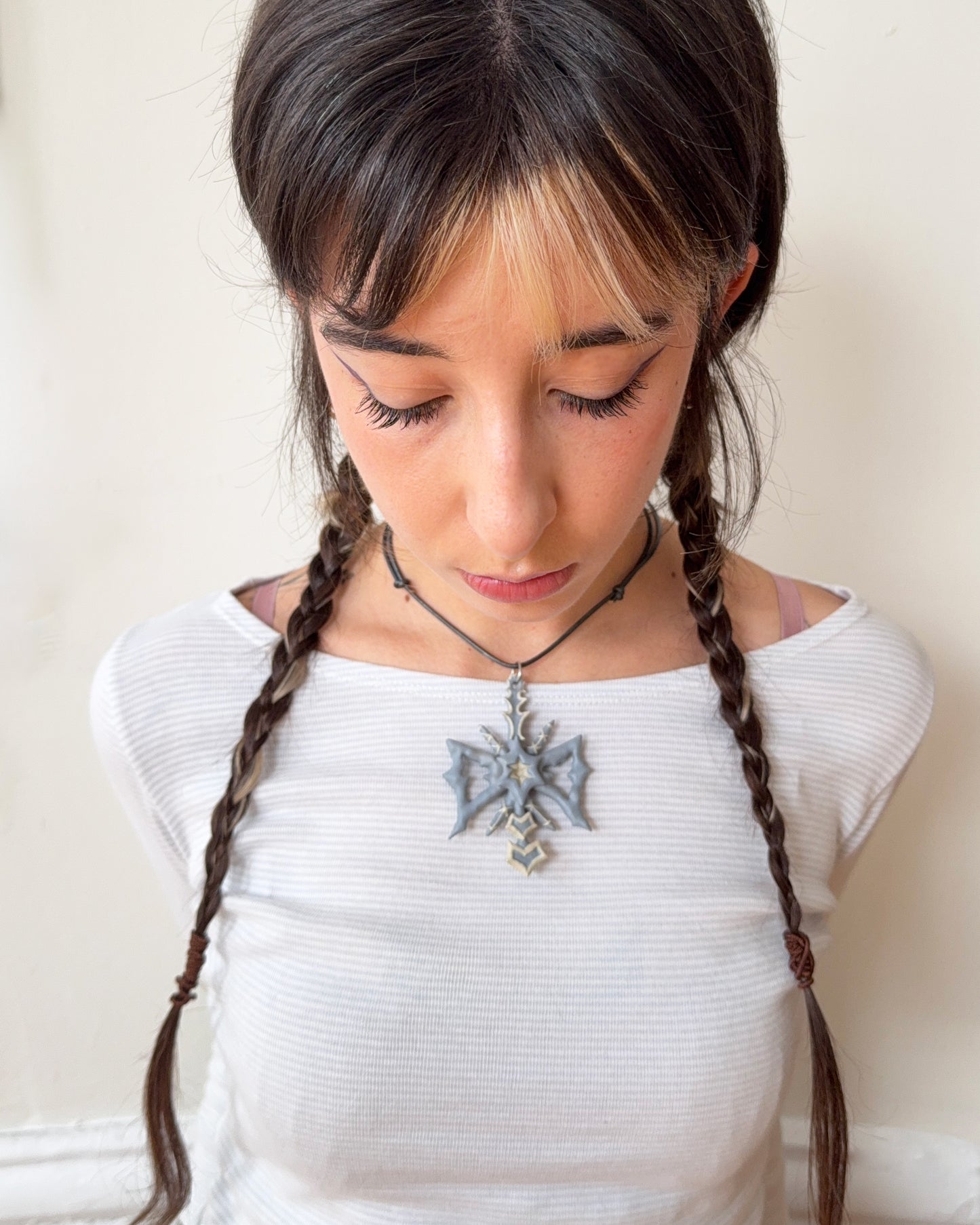 spikey bow drop necklace