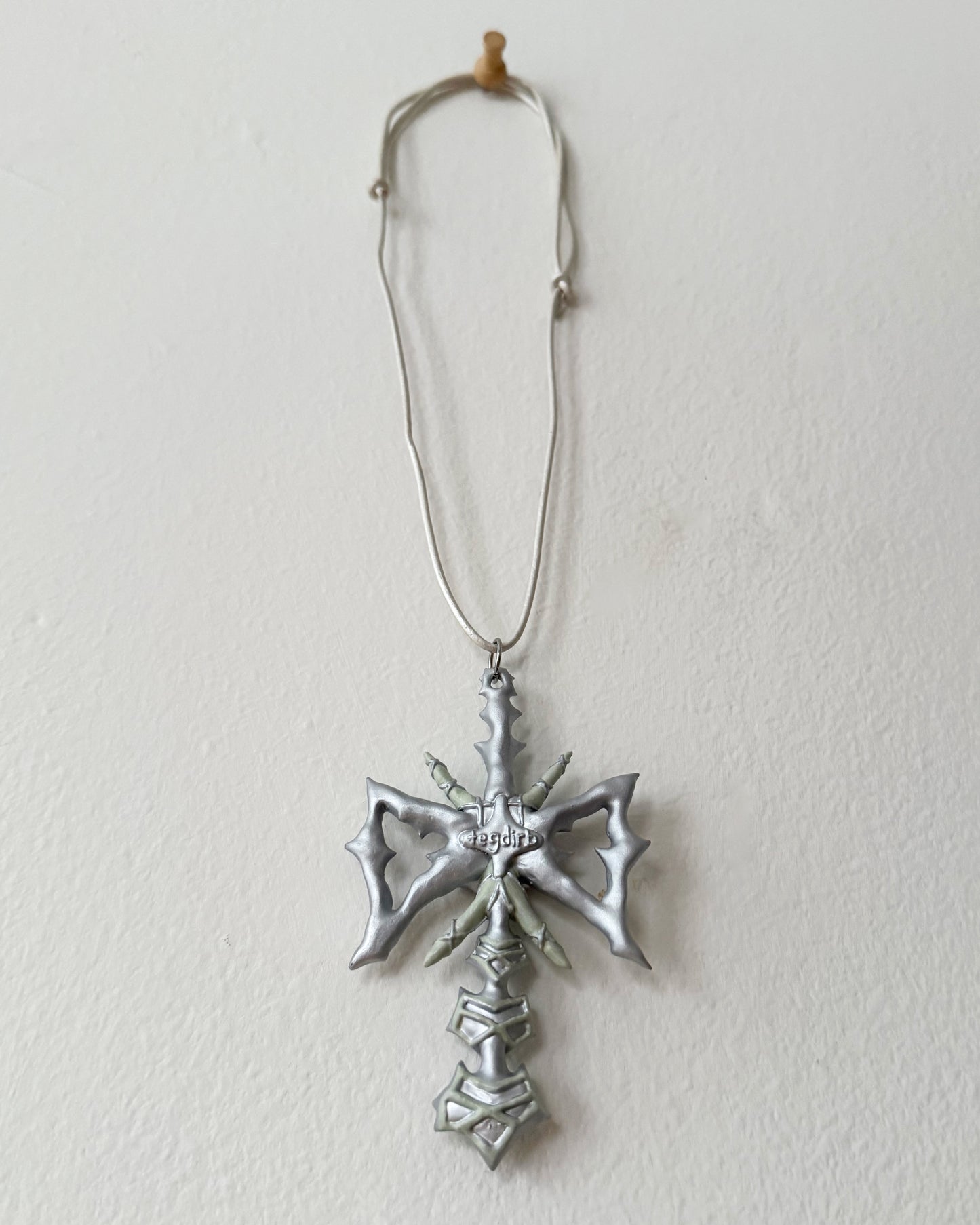 spikey bow drop necklace